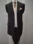 Black lightweight three-quarter jacket with grey stripe trousers and coffee waistcoat (6kb)